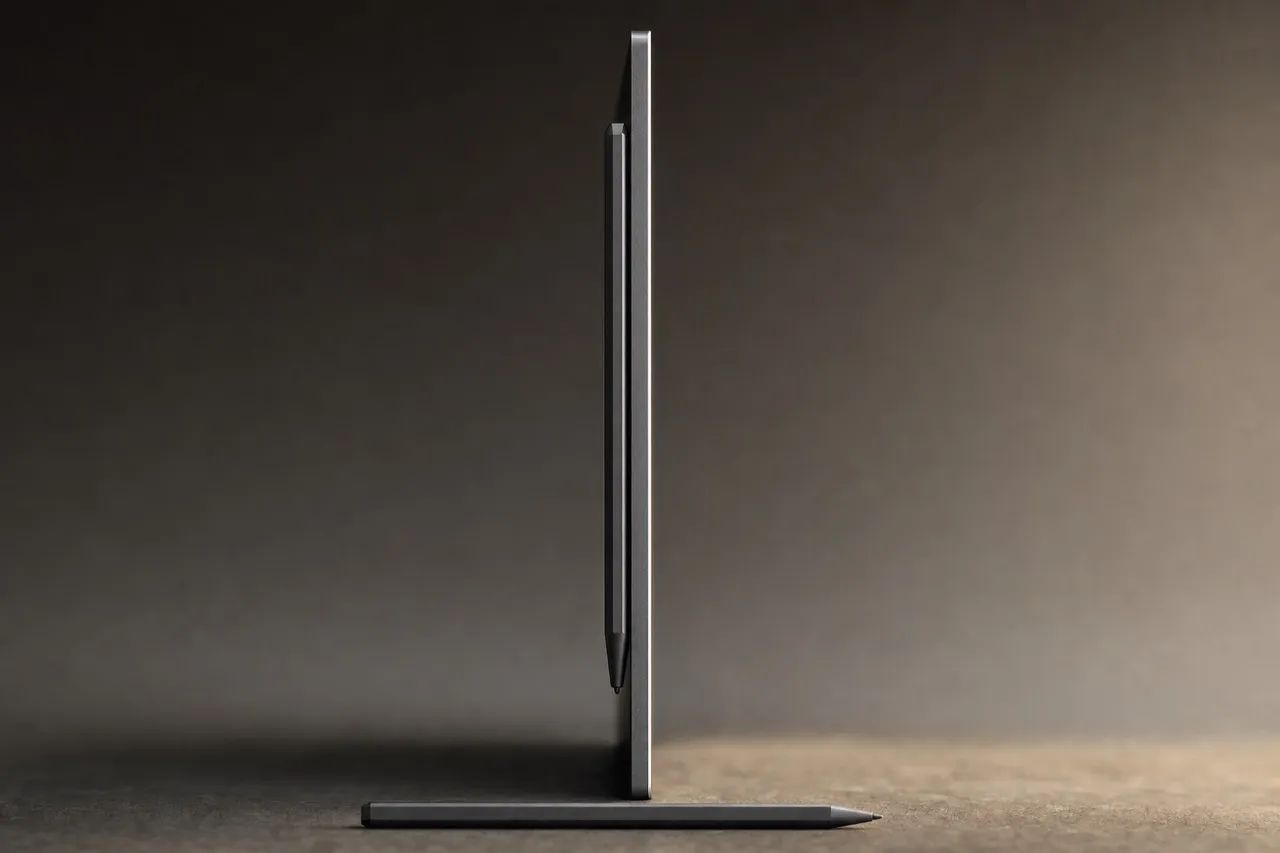 Edge-on profile of the tablet standing upright, showing how thin it is